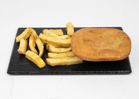 Jonaldo’s steak pie served with a portion of golden-brown chips.